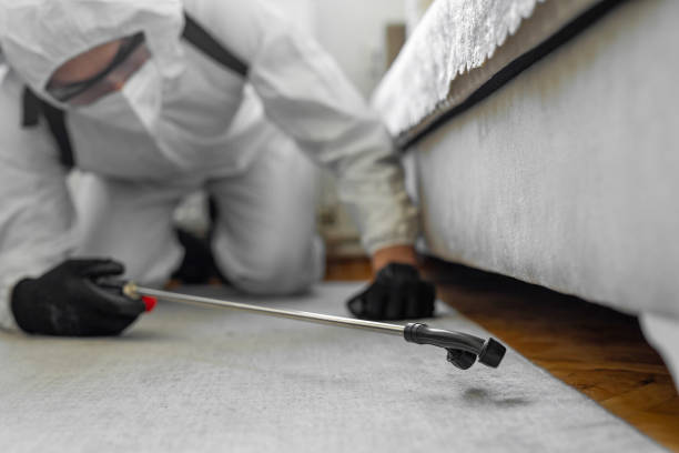Professional Pest Control technician working in Logan County County, ND